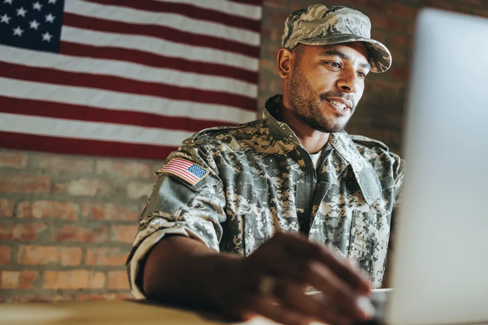 A service member completing a cognitive assessment on a laptop